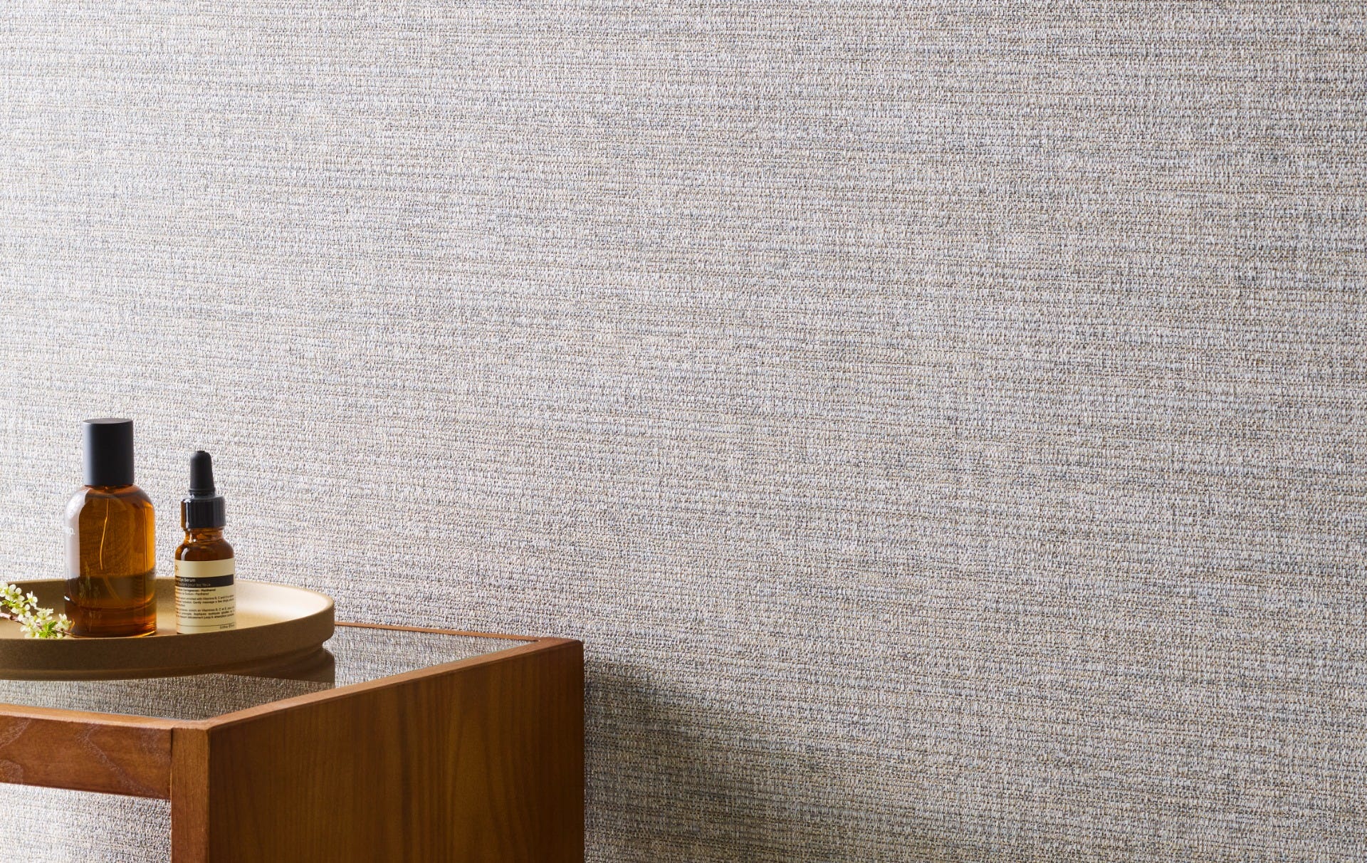 Grey Xorel wallcovering beside a timber console